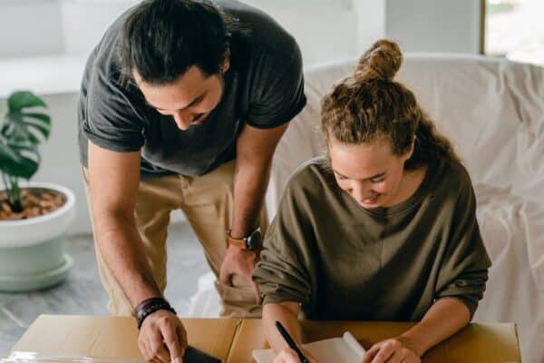 a-cheerful-couple-organizing-their-move-into-a-new-home-surrounded-by-boxes-and-notes - Adam C. Gynac & Associates LLC Essential Estate Planning Services | Adam C Gynac Associates LLC Joliet Adam C Gynac Associates LLC Page 4