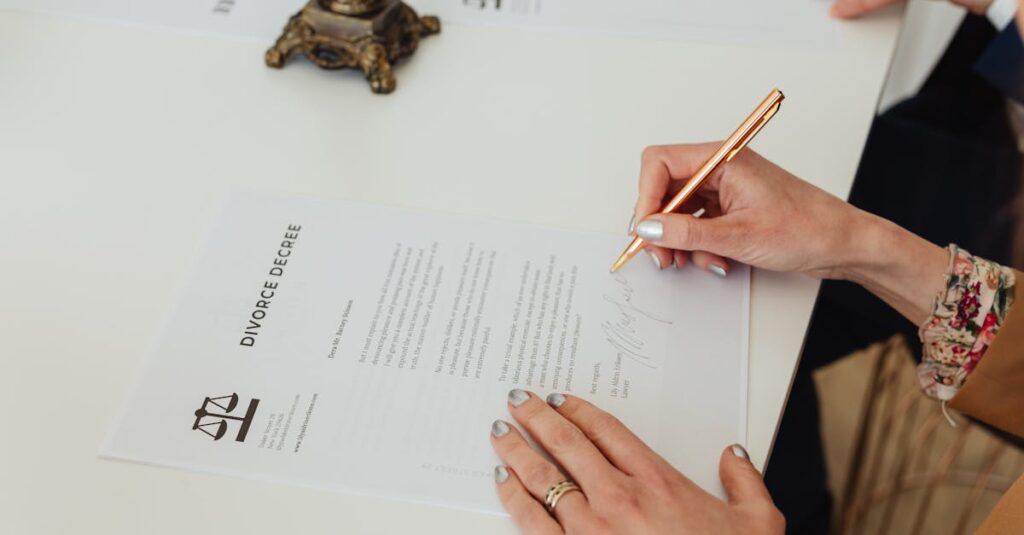 close-up-of-hands-signing-a-divorce-decree-document-on-a-desk-showcasing-legal-process
