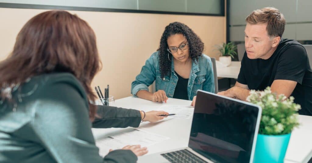 couple-meeting-with-advisor-for-adoption-process-in-a-modern-office-setting
