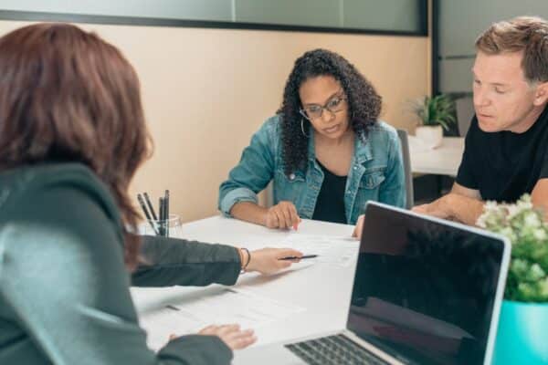 couple-meeting-with-advisor-for-adoption-process-in-a-modern-office-setting - Adam C. Gynac & Associates LLC Adoption Attorney Services | Adam C Gynac Associates LLC Joliet IL Adam C Gynac Associates LLC Page 9